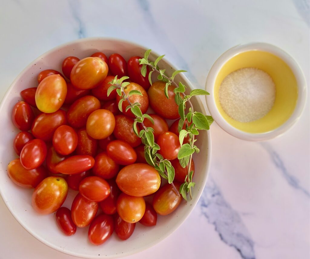 Bowl of tomatoes and bowl of sea salt