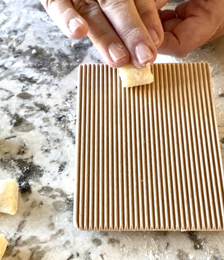 Rolling gnocchi on a gnocchi board