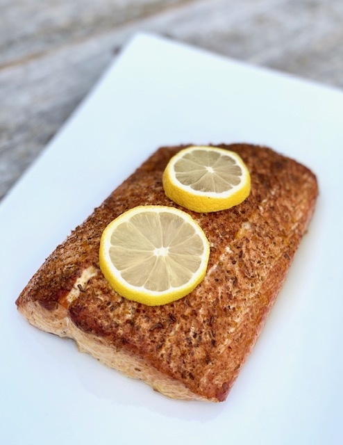 Grilled Salmon with Potlatch Seasoning and lemons
