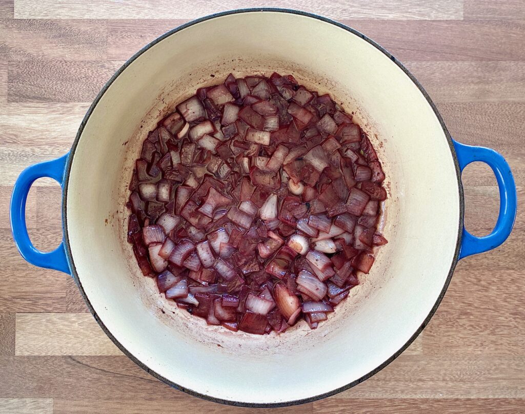 sauteed onion with red wine in a pot