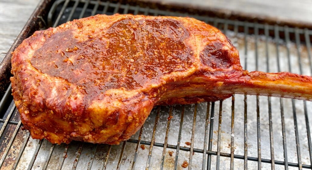 spice rubbed meat on a rack
