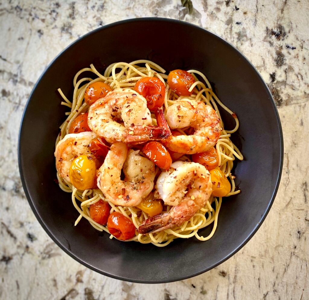 Bowl of pasta shrimp and tomatoes
