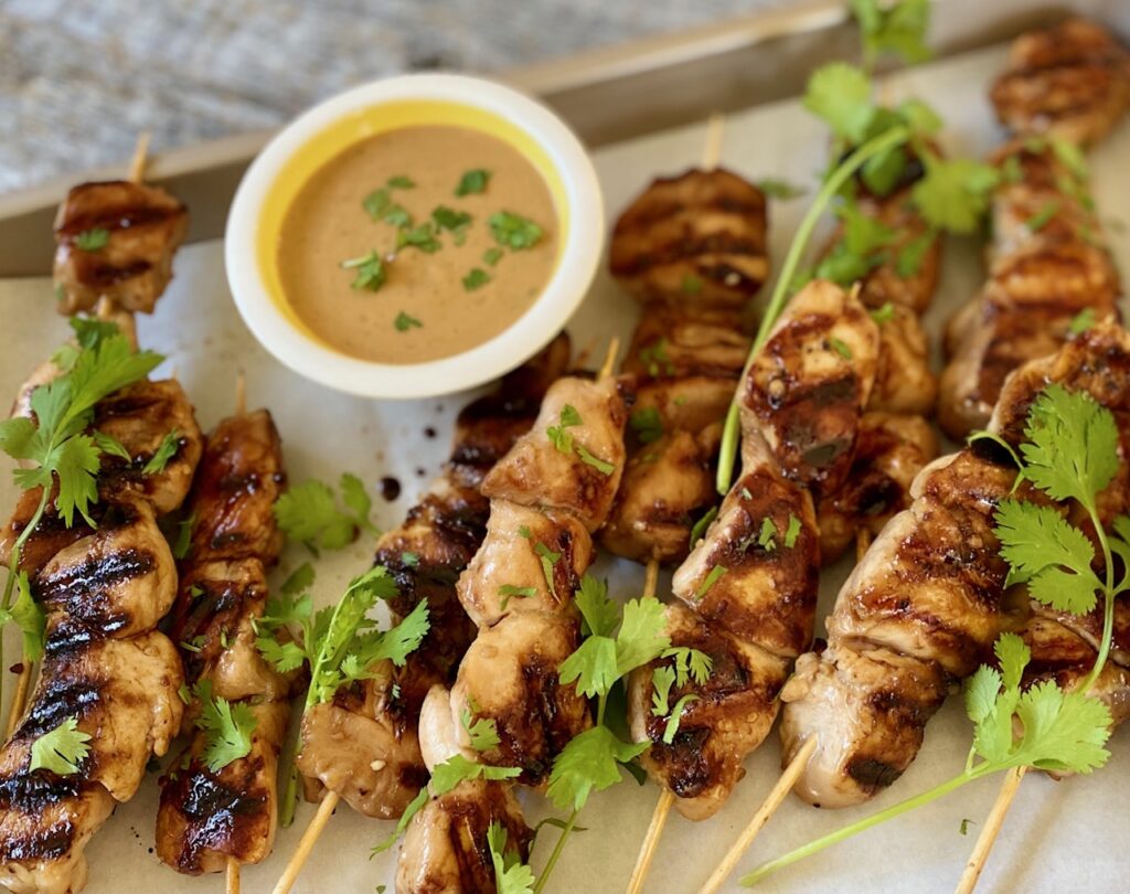 chicken satay on a tray