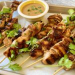 Grilled chicken shishkabobs on a tray