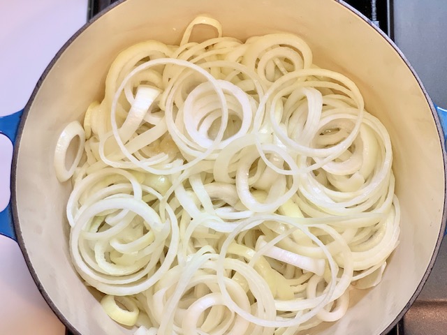 Sliced onions in dutch oven for French Onion Soup