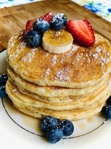 pancakes with fruit on white plate