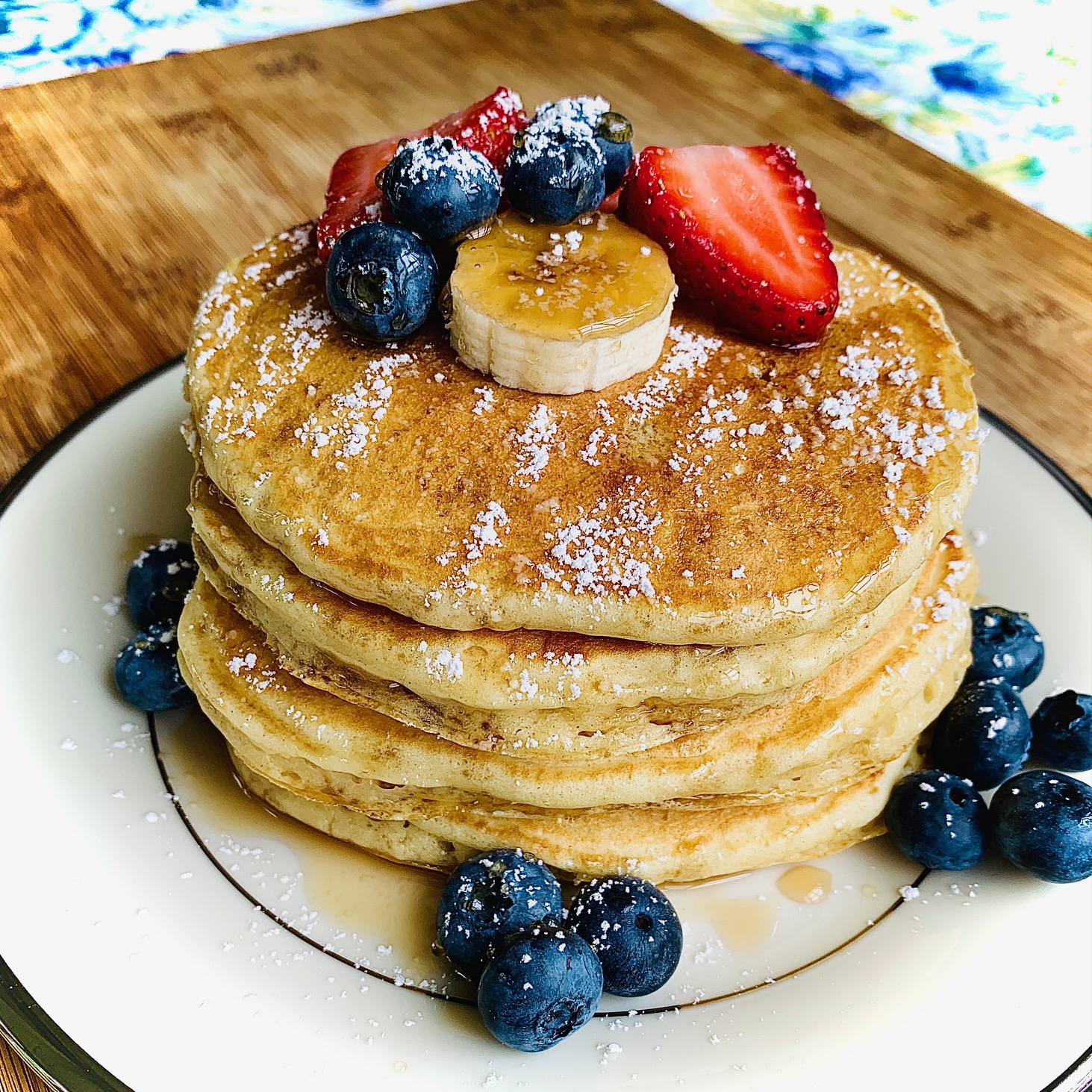 pancakes with fruit on white plate