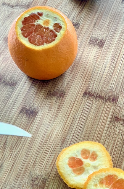 Cut both ends of the orange before cutting peel off