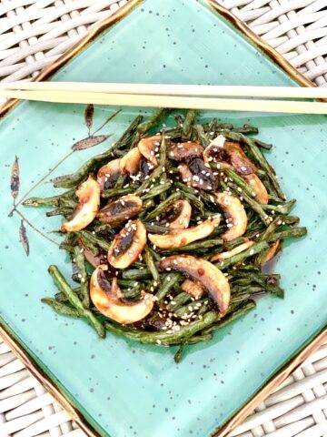 Szechuan beans on blue plate