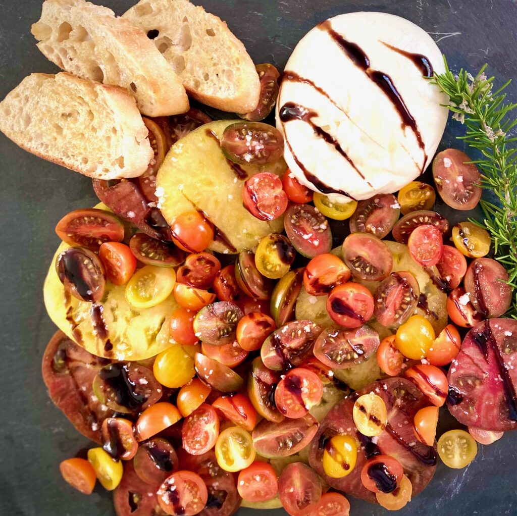 platter of burrata and tomatoes