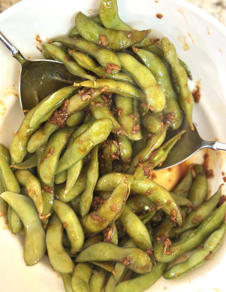 Toss the garlic sauce on Edamame's