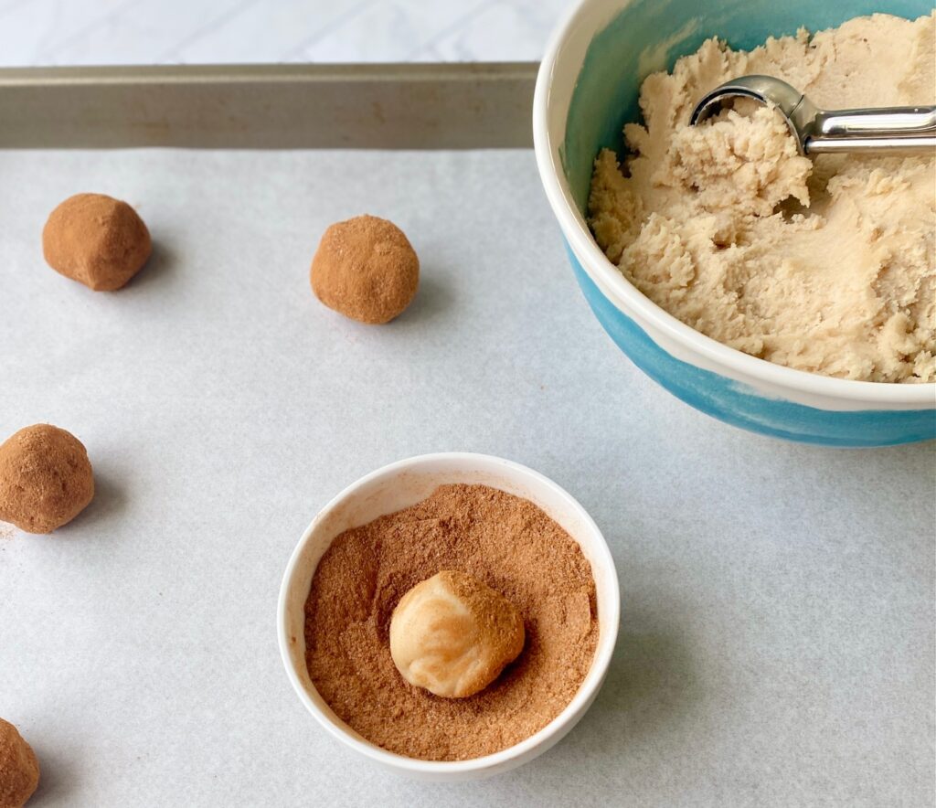 tray of cookies and scooped dough