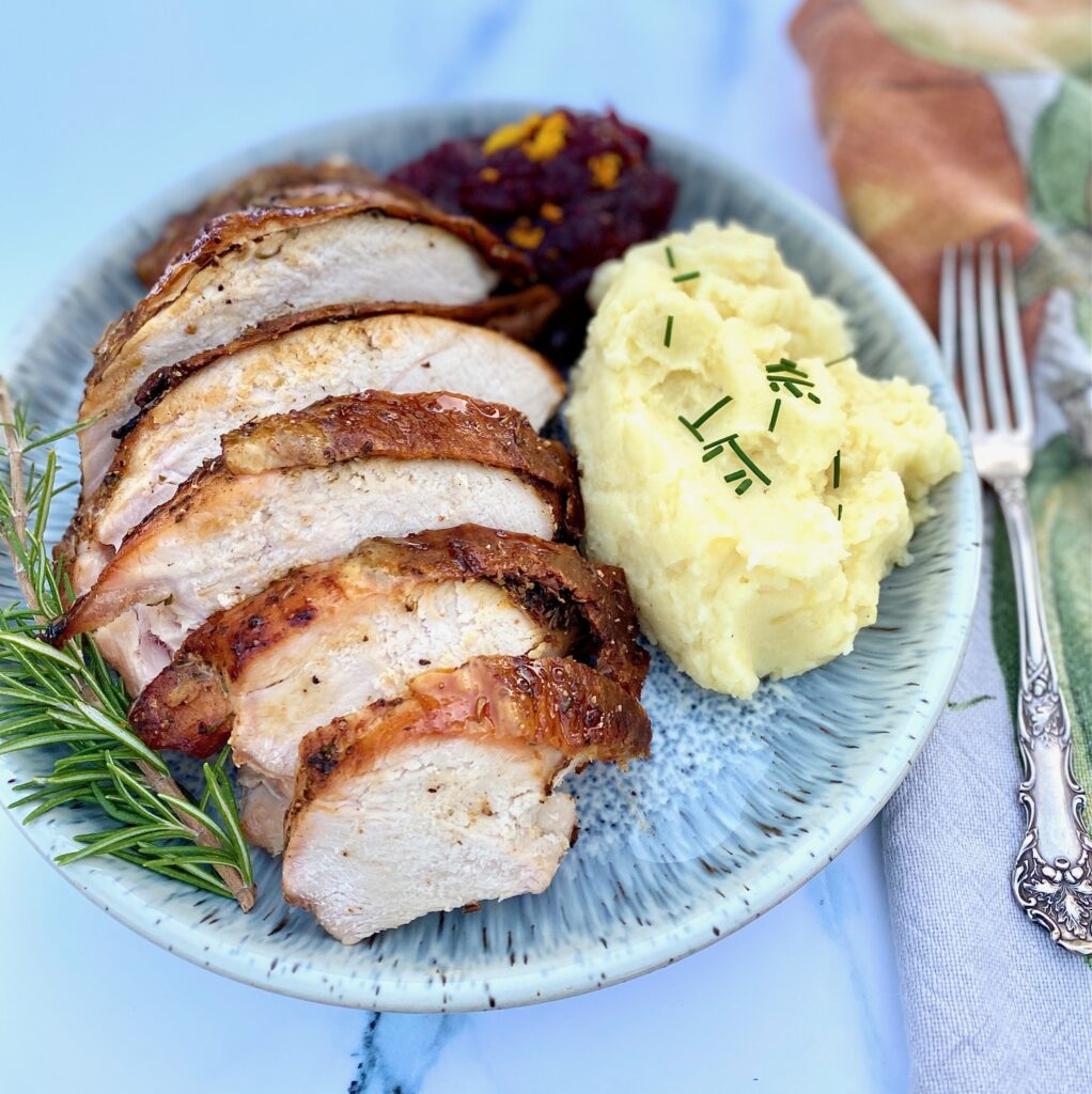 turkey, mashed potatoes and cranberries on a plate