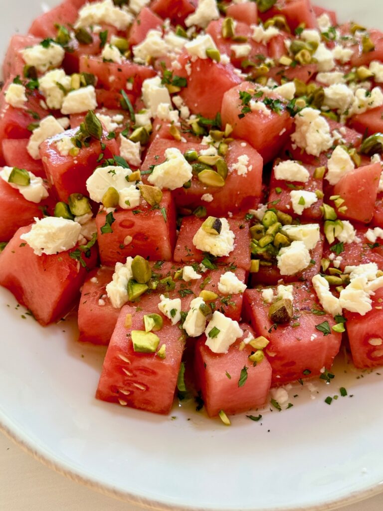 watermelon salad up close on white plate