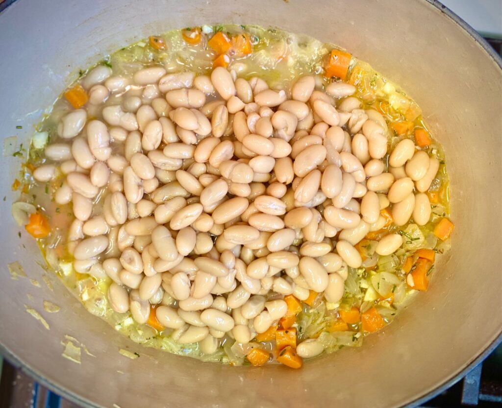 white beans and vegetable in pan